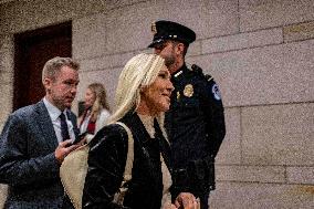Representative Marjorie Taylor Greene walks out  after  the  classified briefing
