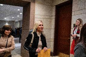 Representative Marjorie Taylor Greene walks out  after  the  classified briefing