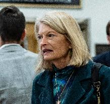 United States Senator  Lisa Murkowski walks out  after  the  classified briefing