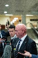 Mark Kelly offers remarks after he came out of a classified briefing