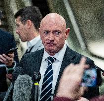 Mark Kelly offers remarks after he came out of a classified briefing