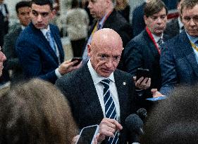 Mark Kelly offers remarks after he came out of a classified briefing