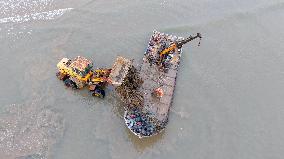Farmers Harvest Oysters in Qingdao
