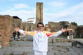 Jackie Chan Holds the Milan Cortina 2026 Olympic Flame - Pompeii