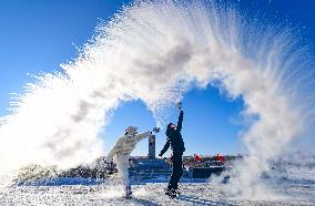 Splashing Water into Ice