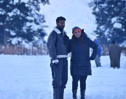 People Enjoy The Season's First Snowfall In Kashmir
