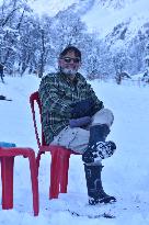 People Enjoy The Season's First Snowfall In Kashmir