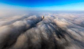 Building Shrouded By Fog And Cloud - Kuwait City
