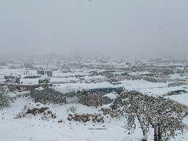 Snowstorms hit Syrian refugee camps.