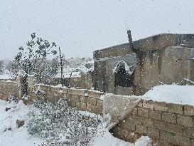 Snowstorms hit Syrian refugee camps.