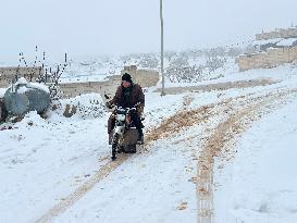 Snowstorms hit Syrian refugee camps.