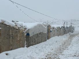 Snowstorms hit Syrian refugee camps.