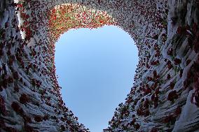 Heart-shaped  Ice Sculpture Enclosed Red Roses Inside