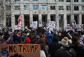 Anti-ICE protesters gather outside the US Immigration and Customs Enforcement (ICE)  headquarters