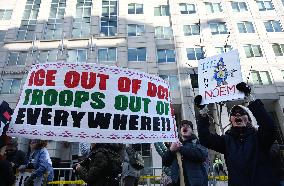 Anti-ICE protesters gather outside the US Immigration and Customs Enforcement (ICE)  headquarters