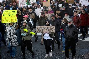 Anti-ICE protesters gather outside the US Immigration and Customs Enforcement (ICE)  headquarters