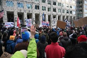 Anti-ICE protesters gather outside the US Immigration and Customs Enforcement (ICE)  headquarters