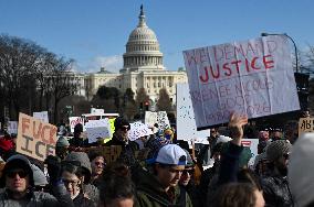 Anti-ICE protesters gather outside the US Immigration and Customs Enforcement (ICE)  headquarters