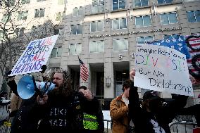 Anti-ICE protesters gather outside the US Immigration and Customs Enforcement (ICE)  headquarters