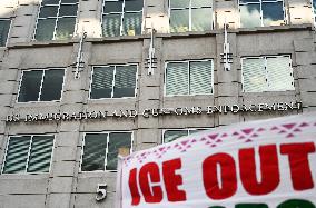 Anti-ICE protesters gather outside the US Immigration and Customs Enforcement (ICE)  headquarters