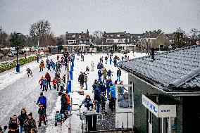 People Skate on Natural Ice Rink in Boskoop - Netherlands