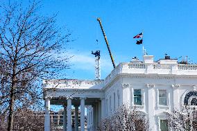 A tower crane is built in the White House Ballroom construction zone where the East wing previously stood at the White House