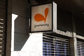 Gourmet City signboard and logo
