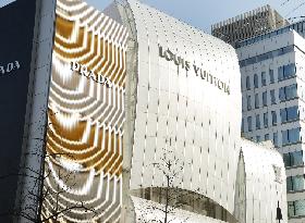 Louis Vuitton, Prada signs and logos