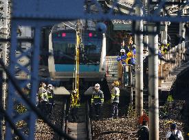 CORRECTED: Power outage stops train in Japan