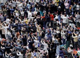 Emperor watches New Year sumo tournament