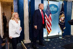 US President Trump speaks on to reporters ahead of trip to Davos