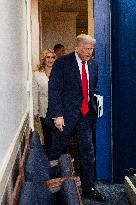 US President Trump speaks on to reporters ahead of trip to Davos