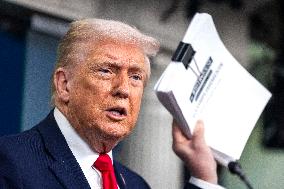 US President Trump speaks on to reporters ahead of trip to Davos