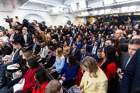 US President Trump speaks on to reporters ahead of trip to Davos