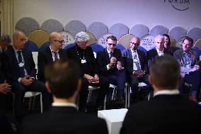 Macron and with leaders of AI companies at World Economic Forum annual meeting - Davos