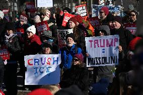 People protest on the first anniversary of President Donald Trump's second term in office