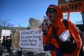 People protest on the first anniversary of President Donald Trump's second term in office