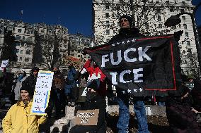 People protest on the first anniversary of President Donald Trump's second term in office