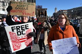 People protest on the first anniversary of President Donald Trump's second term in office
