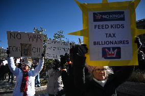People protest on the first anniversary of President Donald Trump's second term in office