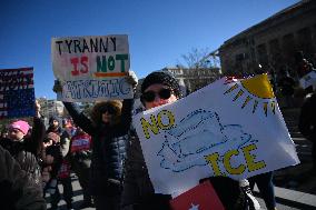 People protest on the first anniversary of President Donald Trump's second term in office
