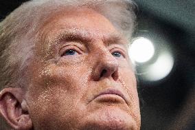 US President Trump speaks on to reporters ahead of trip to Davos