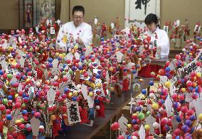Making of lucky charms at western Japan shrine