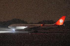 Twin giant pandas' arrival in China from Japan