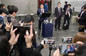 Japan trade minister Akazawa holds a press