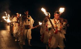 Ritual to pour holy water into river in Japan