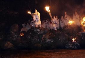 Ritual to pour holy water into river in Japan