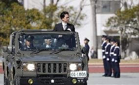 Japan defense chief attends troop inspection ceremony