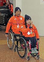 Paralympic medalists return to Japan