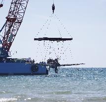 Japanese World War II fighter salvaged from sea